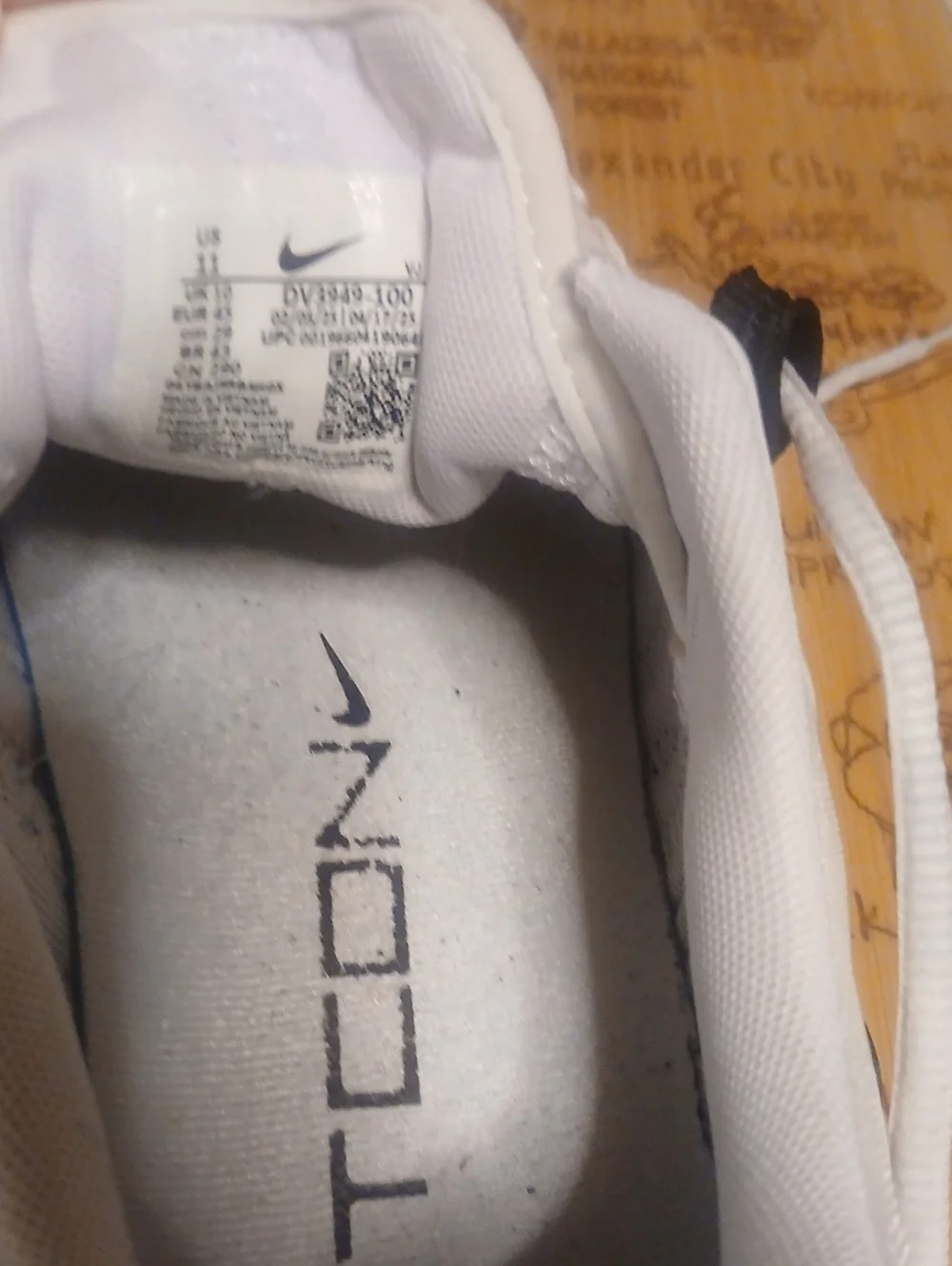 Nike Men’s White Athletic Shoes with Orange and Black Accents